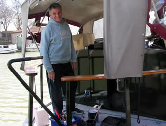 John painting the boat