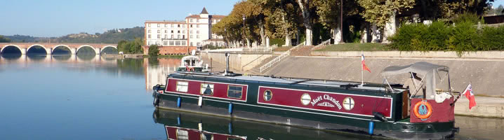Moet Chandon coming out of the double lock onto the river Tarn in Moissac