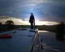 Our son Mike getting a better view of the sunset from the roof deck