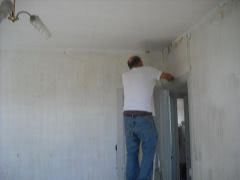 David helps strip back bedroom wall's