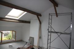 We paint the loft then comes cleaning and staining the beams