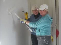 Tina and I painting back bedroom with first coat of paint